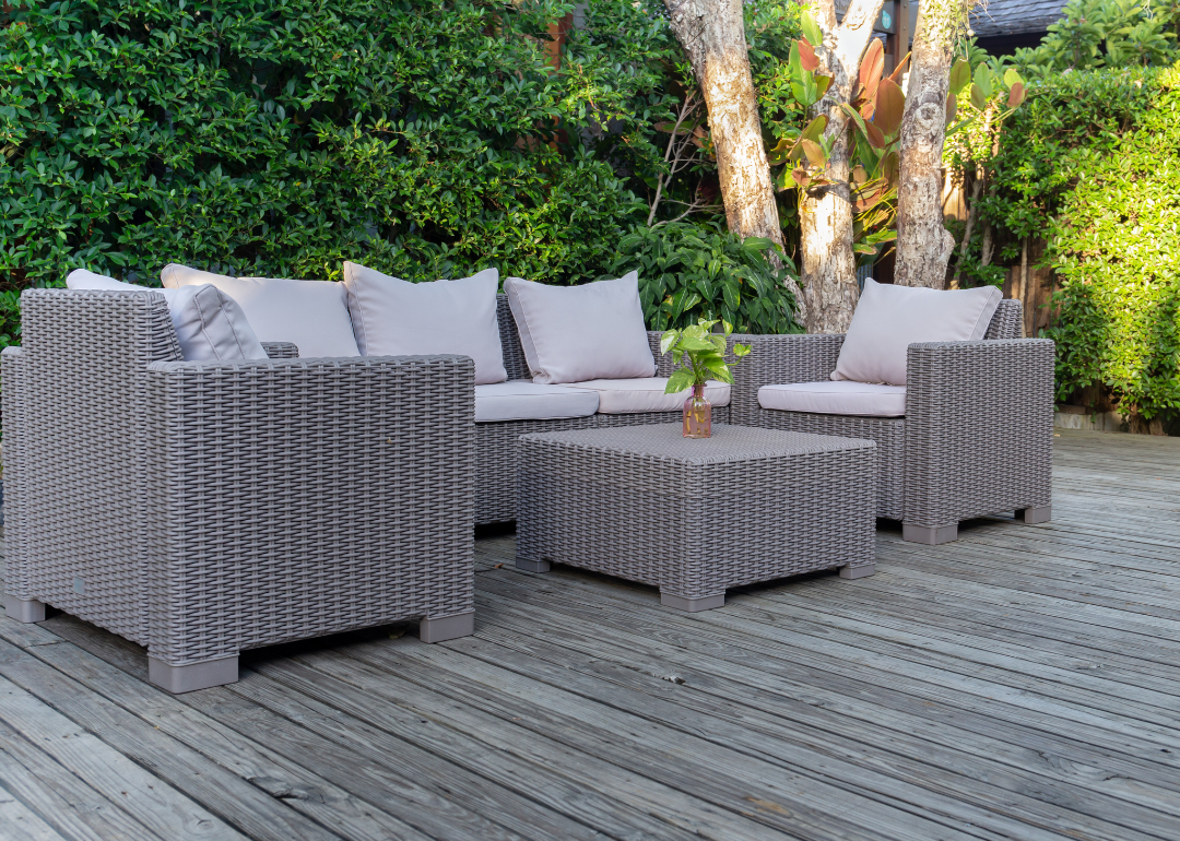 A terrace with outdoor furniture, including an outdoor coffee table with storage