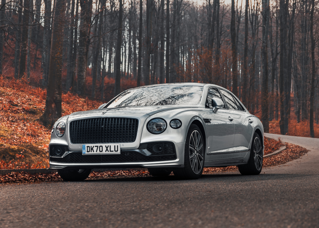 A Bentley Flying Spur driving on a road in Romania.