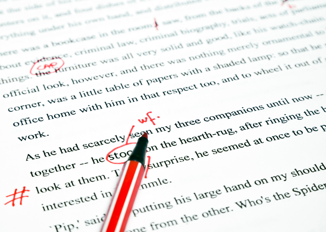 An written draft marked in red pen.