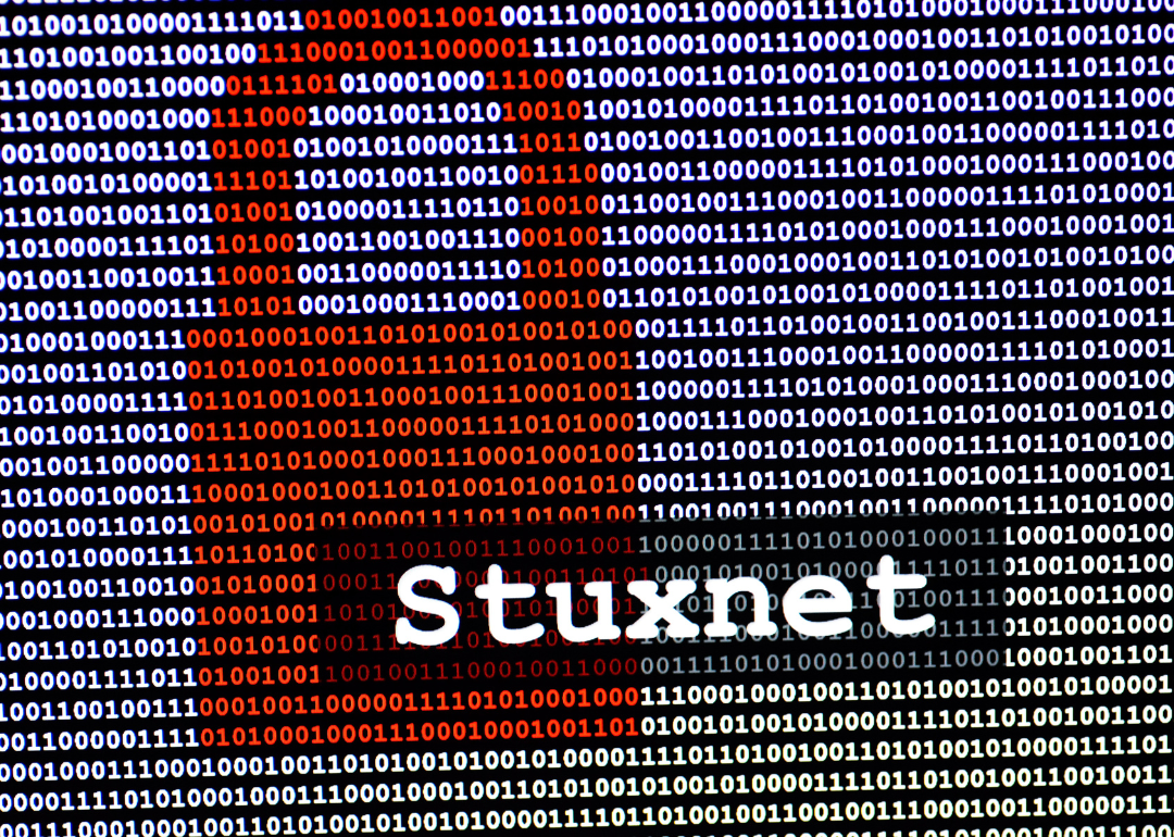 The name of the computer virus Stuxnet in front of a binary background.