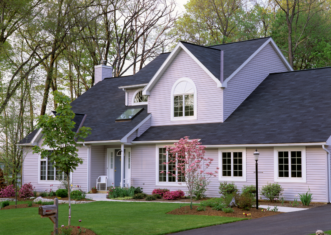 A two-story, gray suburban home in 1994.