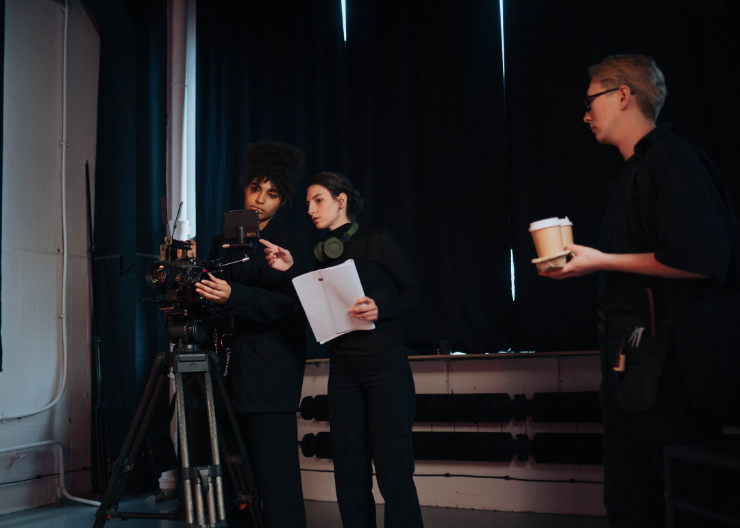 A director reviewing footage while on set.