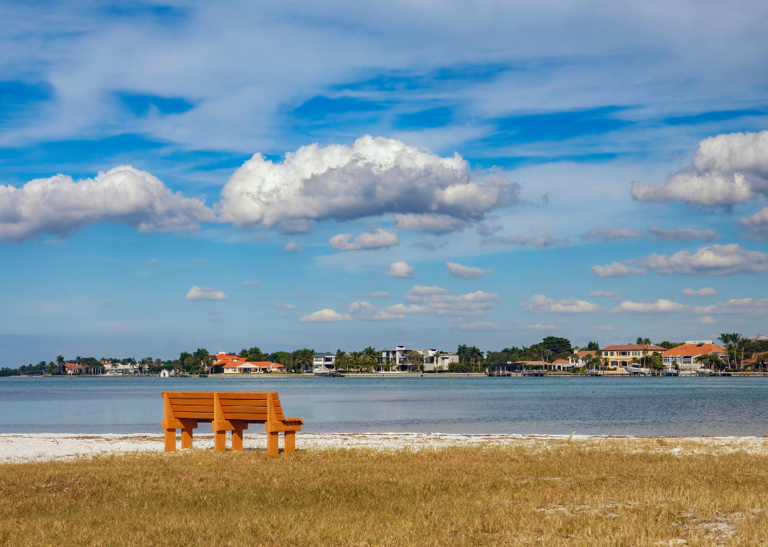 A lone bench near a beach in South Sarasota, Florida.