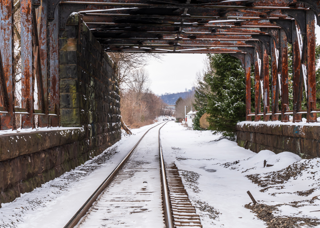 A train tunnel with snow covered train tracks on a winter day in Aspinwall.