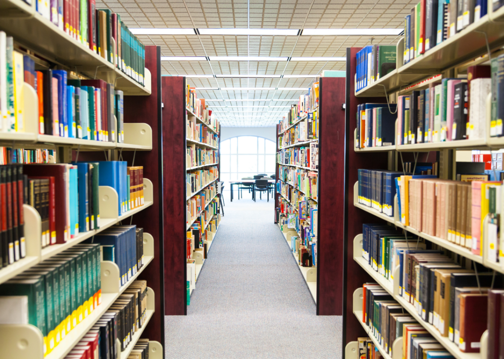 Bookshelves forming a hallway in a college library.