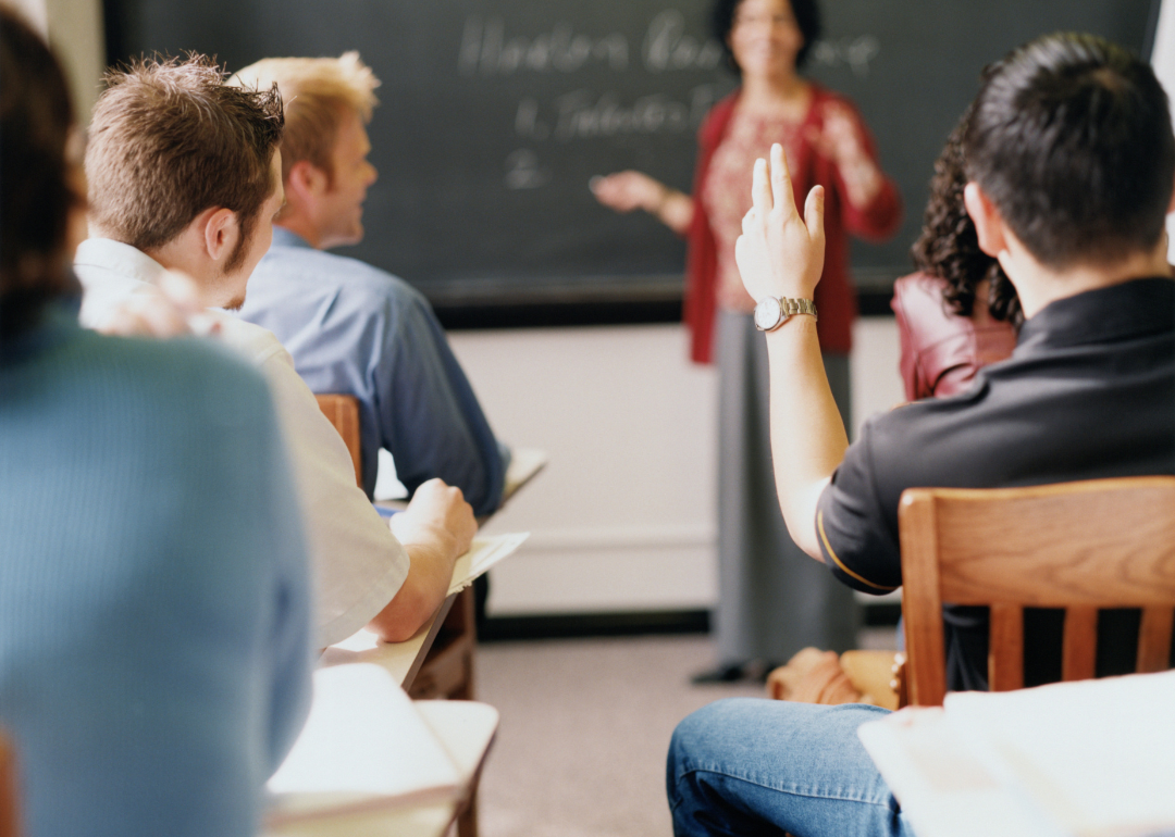 A teacher lecturing a college class.