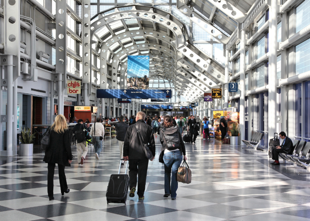 Travelers walk to gates at Chicago O'Hare International Airport