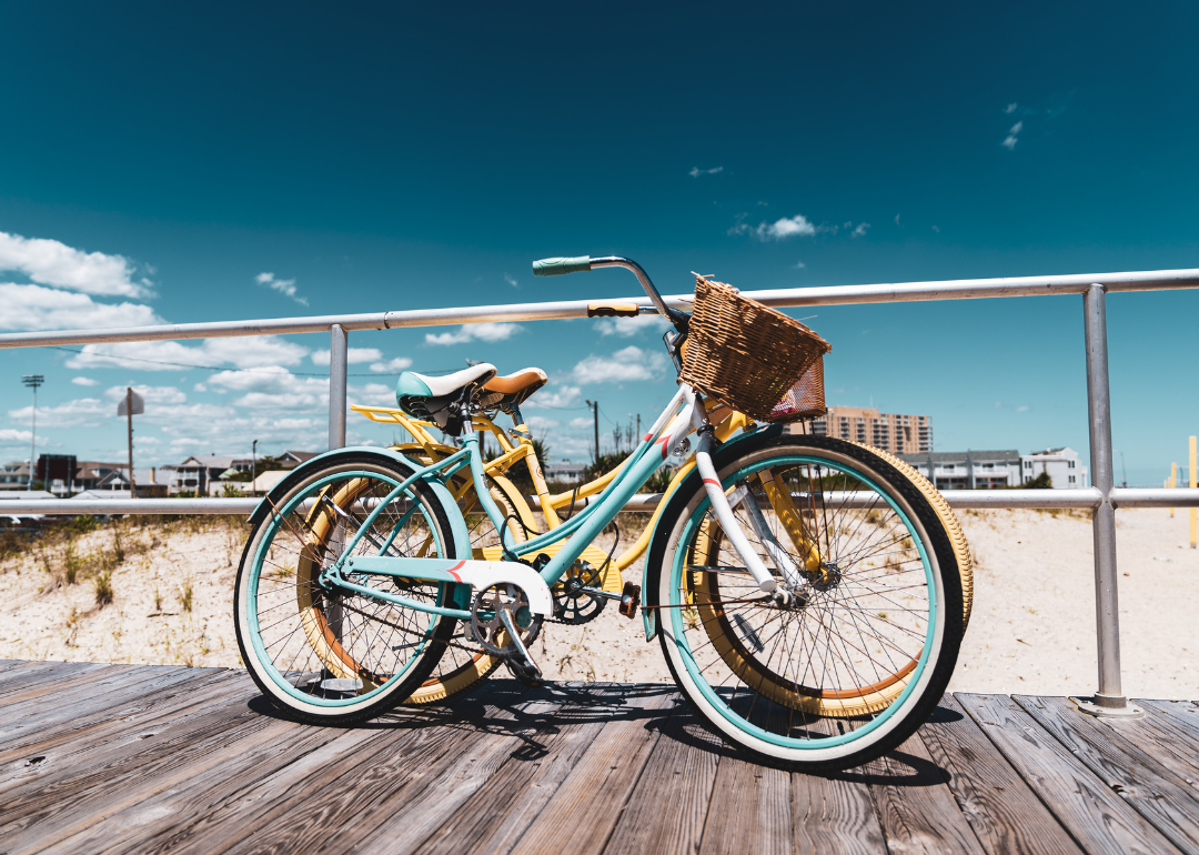 Bicycles on the Jersey Shore boardwalk during a sunny day.