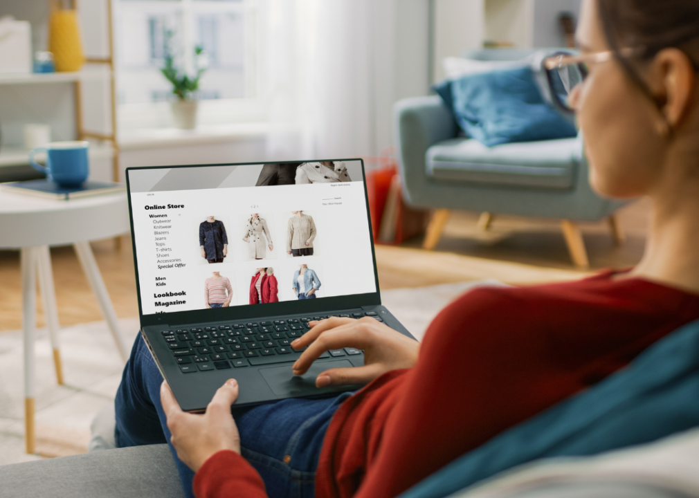 A young woman browsing through recommended items while shopping online.