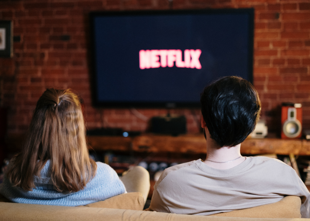 A couple sitting and watching TV