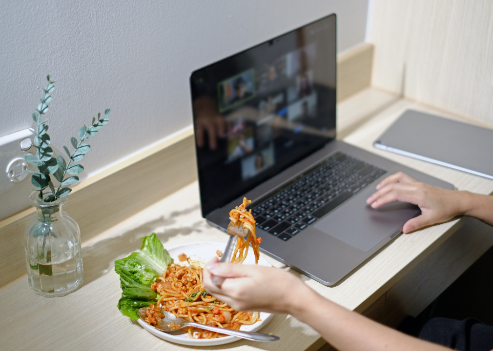 An employee having lunch during a virtual welcome lunch