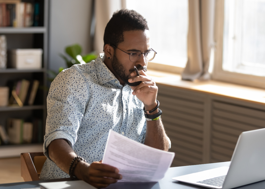 An employee reviewing onboarding documentation 