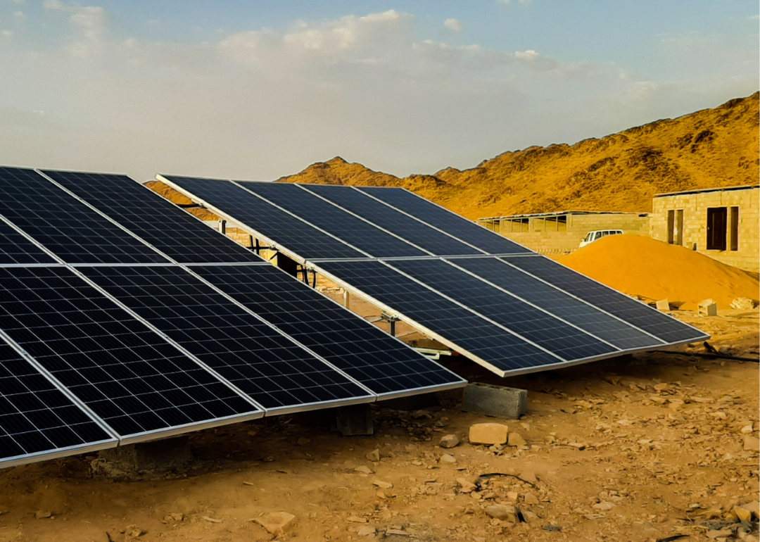 Solar panels powering housing on the outskirts of the city.