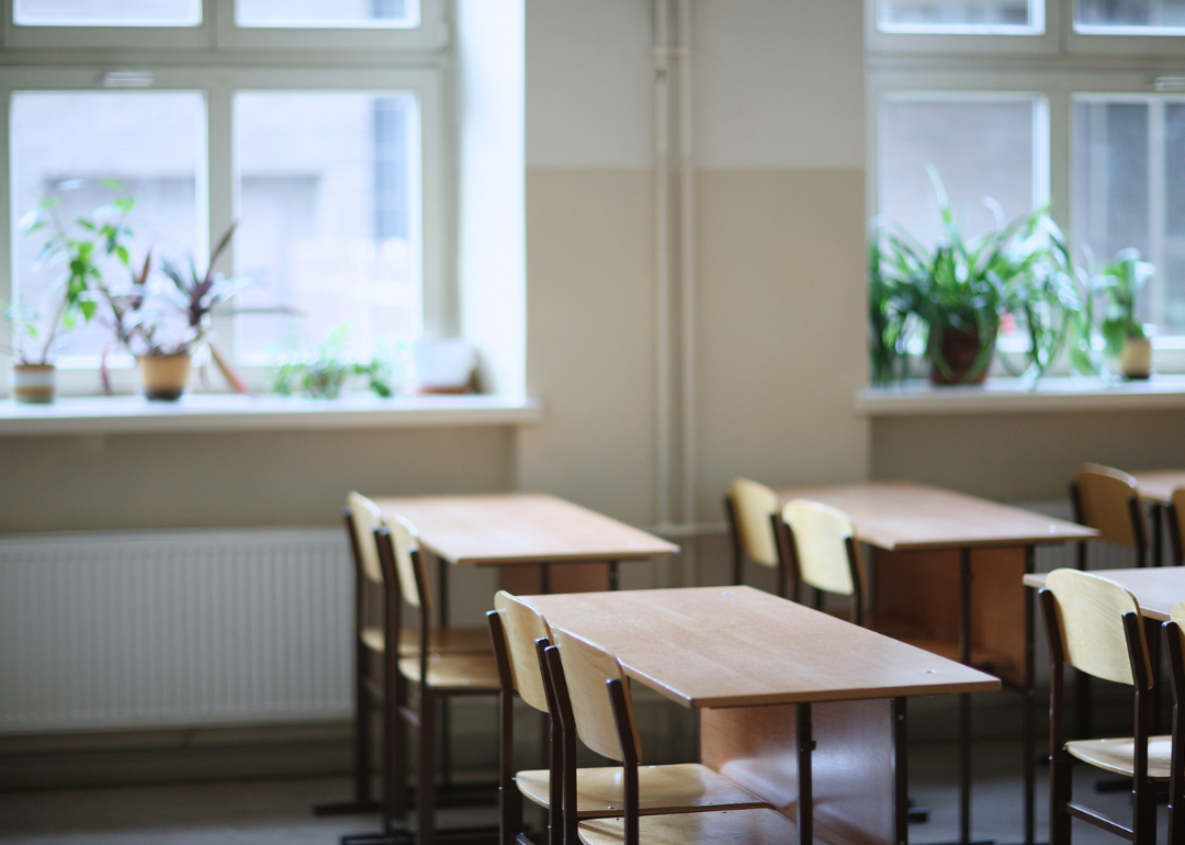 Empty desks in a high school classroom.