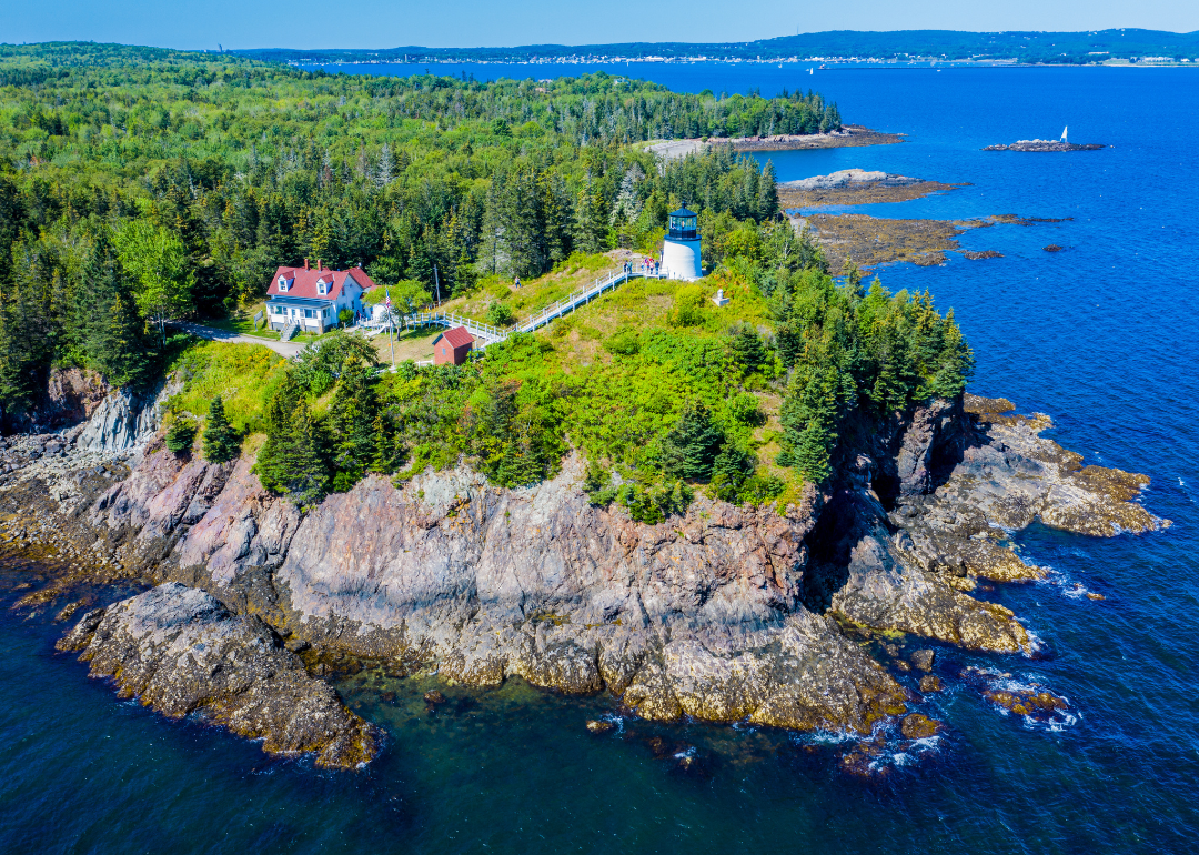An aerial view of Owls Head Light located at the entrance of Rockland Harbor on western Penobscot Bay in the town of Owls Head, Knox County, Maine.