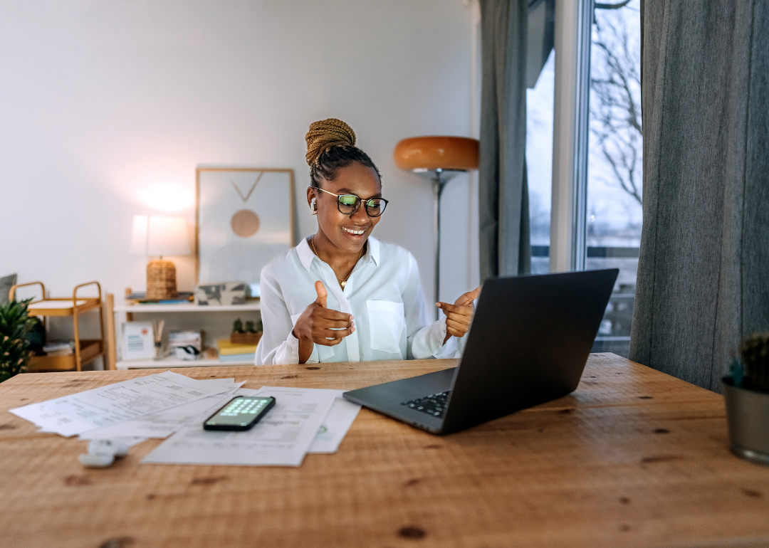 An employee taking a meeting while working from home.