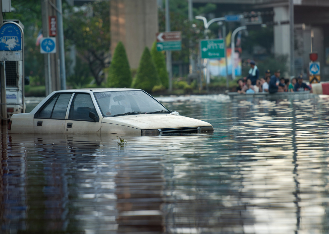A car on a flooded street.
