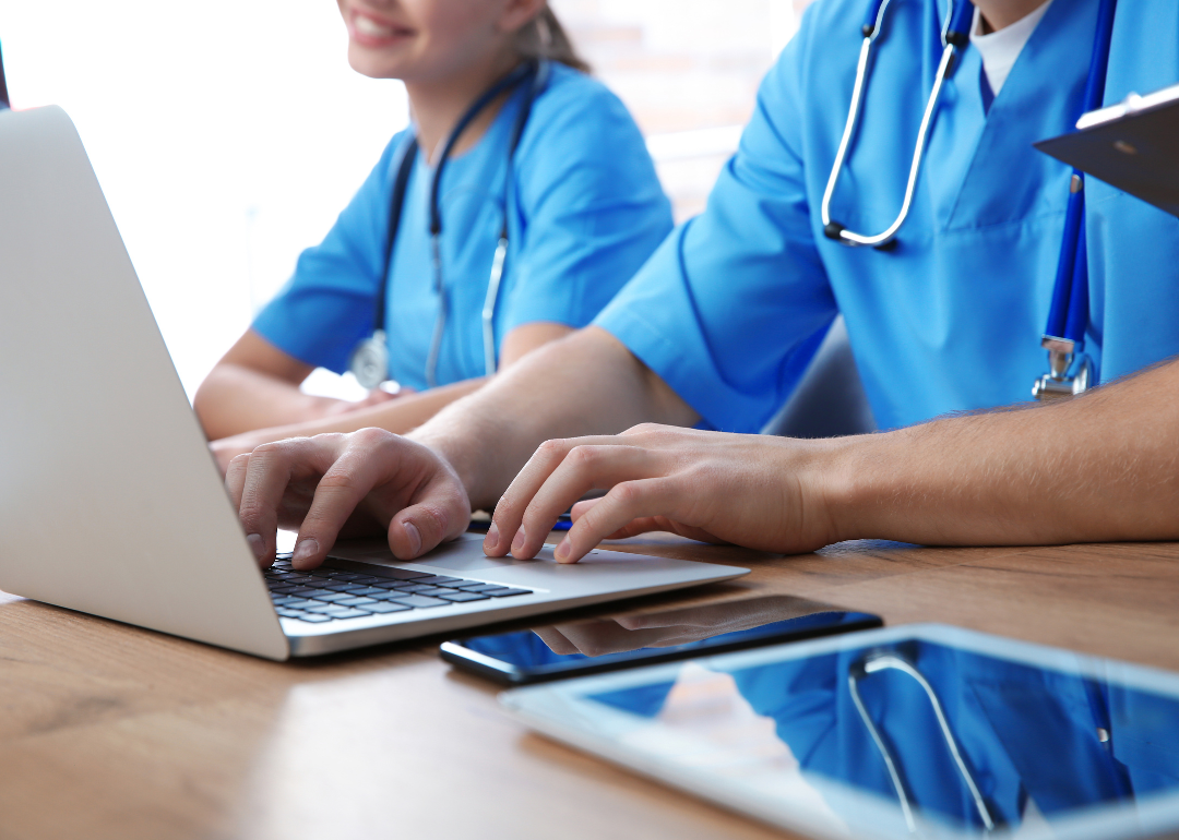 Medical students studying on their laptops.