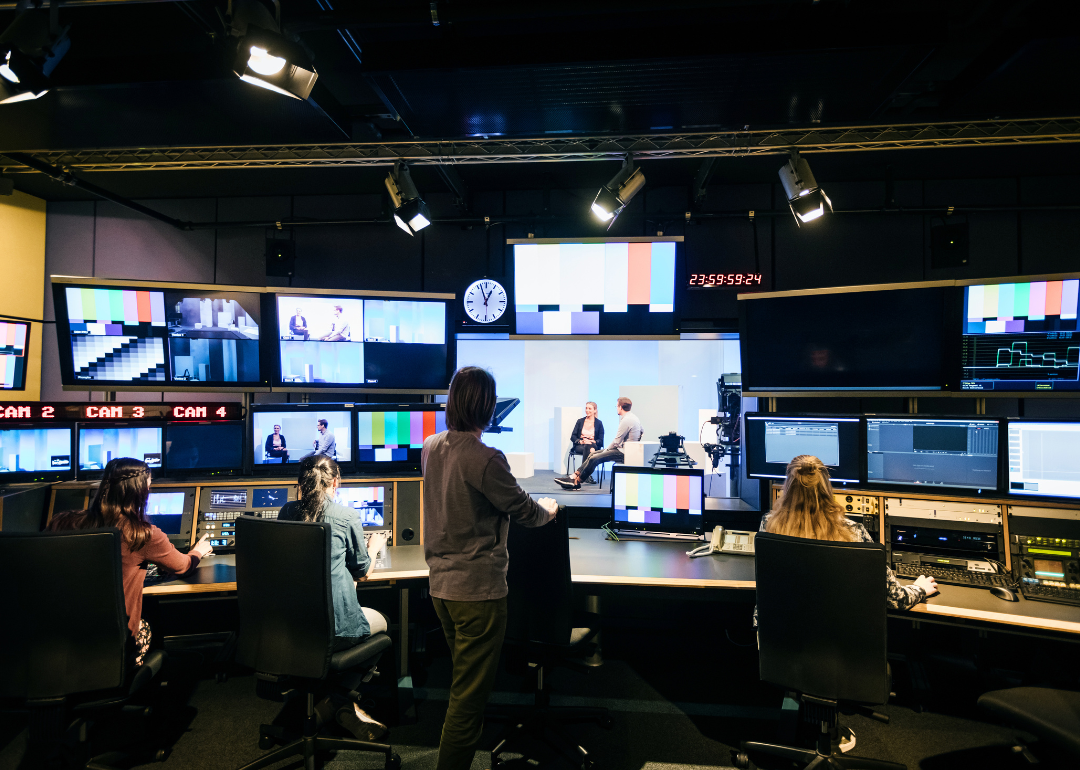 People working in a TV studio.