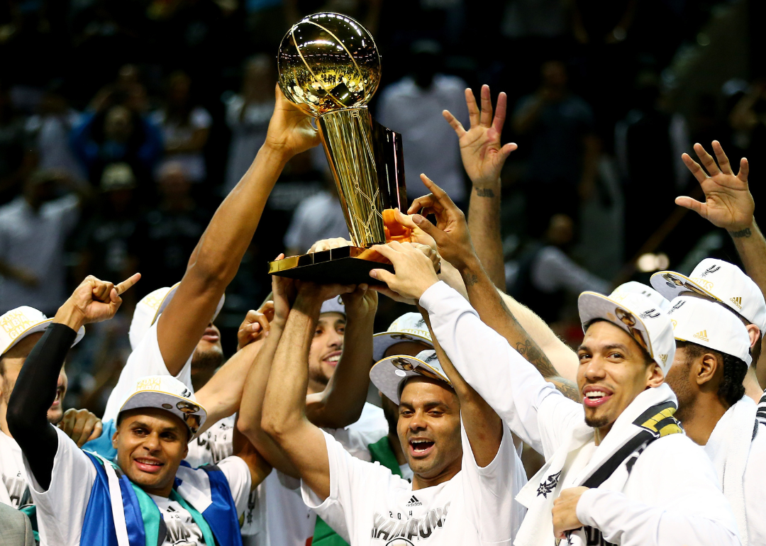 The San Antonio Spurs celebrate after defeating the Miami Heat to win the 2014 NBA Finals.