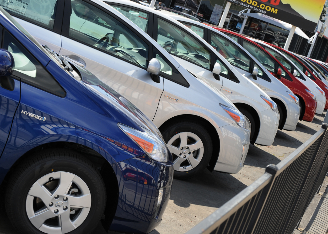 A row of 2008 Toyota Priuses for sale.