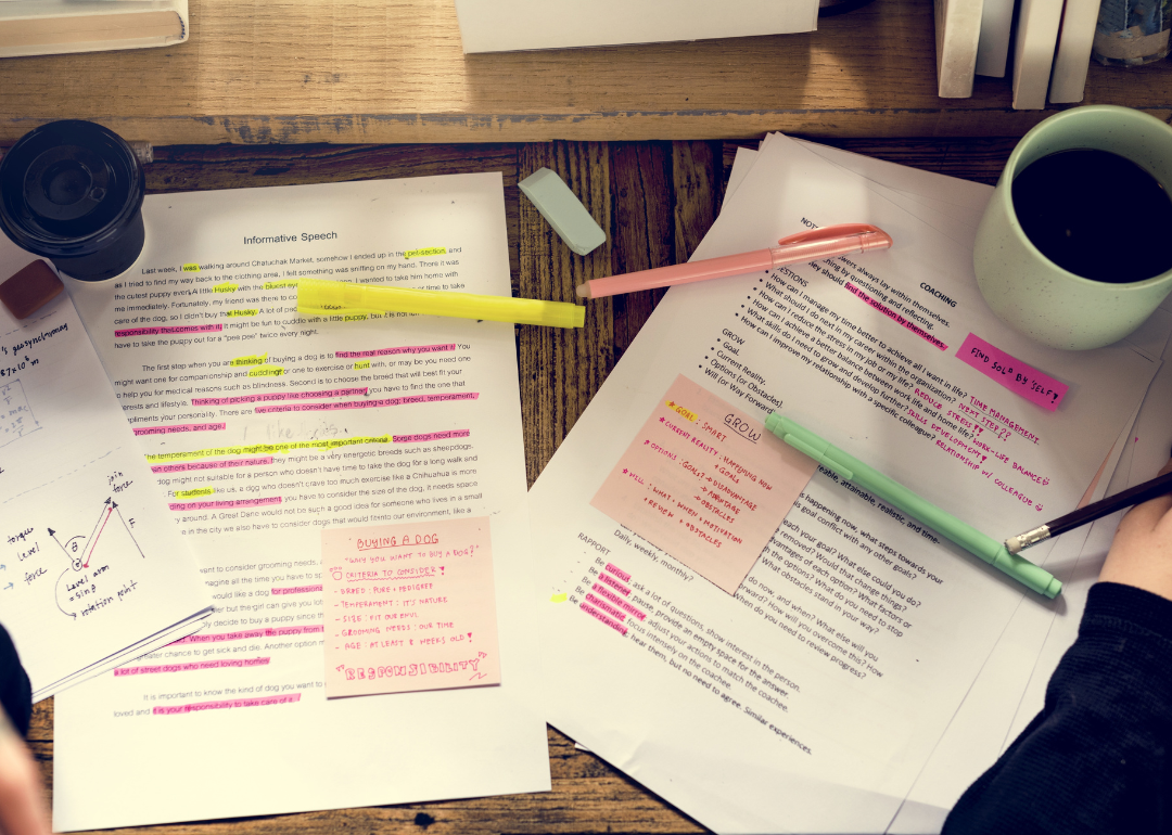 College notes surrounded by highlighters, pens, and coffee.