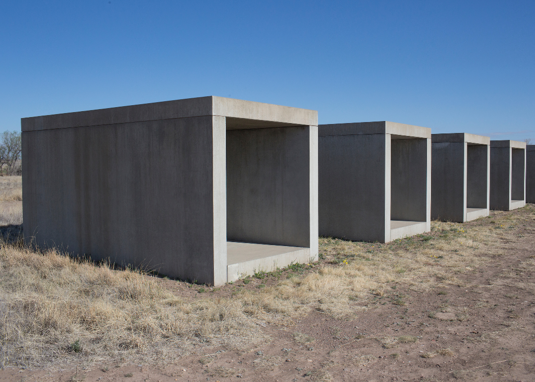 Sculptures by the artist Donald Judd dominating the desert landscape at the Chinati Foundation.
