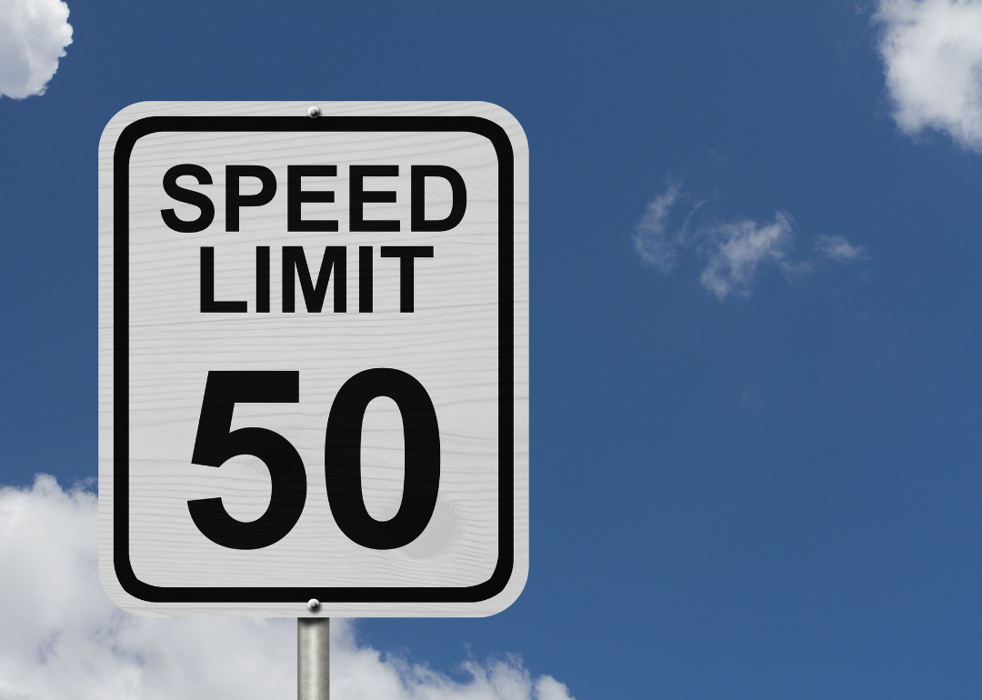 A road sign denoting the speed limit of 50 mph.