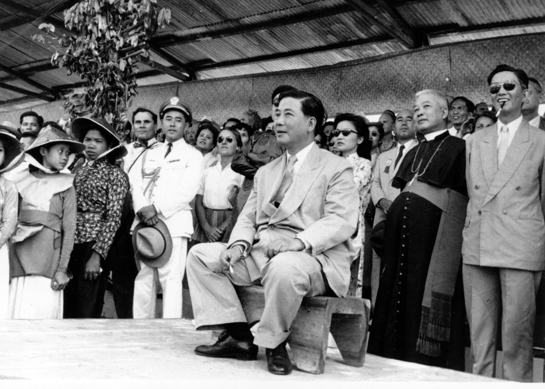 South Vietnam President Ngo Dinh Diem watching an agricultural show following a prior assassination attempt.