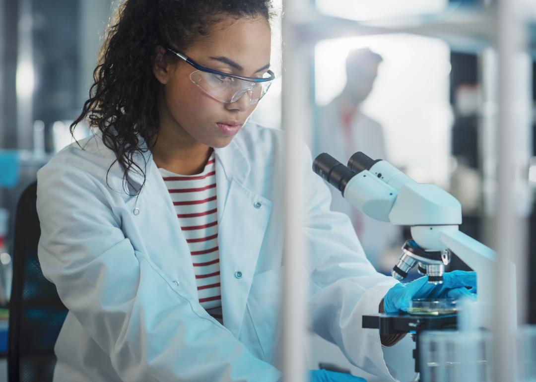 A scientist using a microscope