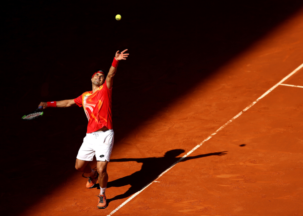 David Ferrer of Spain serving in his match against Roberto Bautista Agusta during day four of the Mutua Madrid Open