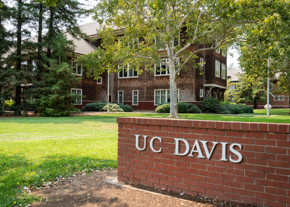 White letters on a brick sign read, U.C. Davis.