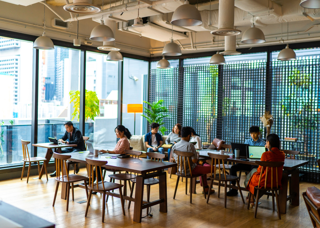 Young people doing their jobs out of a coworking space.