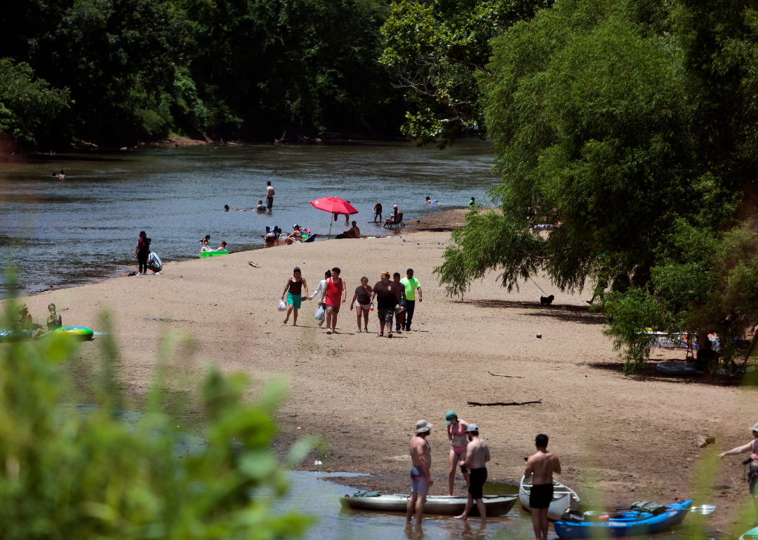 People swimming in the Wolf River to escape a heat wave in Memphis.