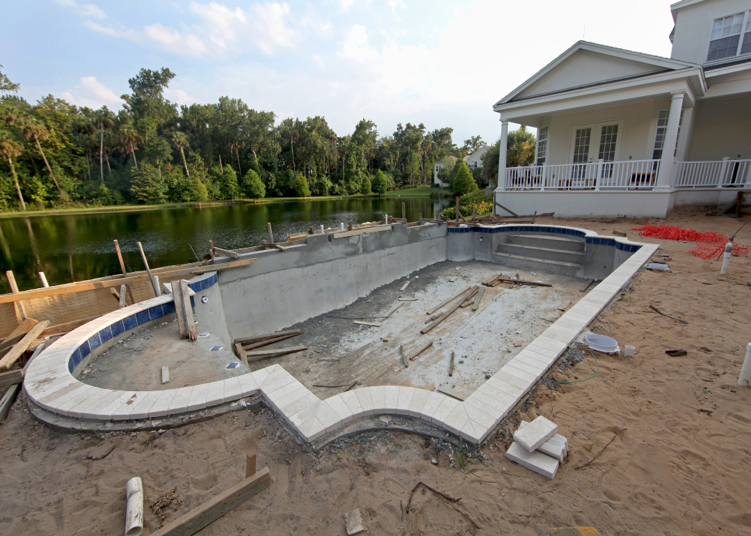 A residential swimming pool under construction in a Florida backyard..