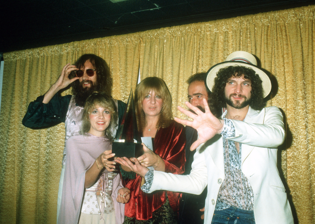 Fleetwood Mac posing for photographers backstage at the 5th American music Awards on January 16, 1978.