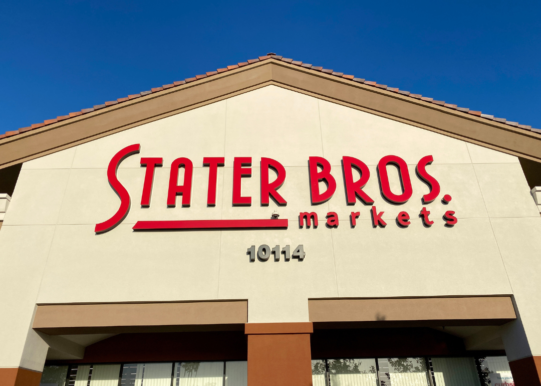 A Stater Bros Market storefront against a blue sky in Huntington Beach, California.
