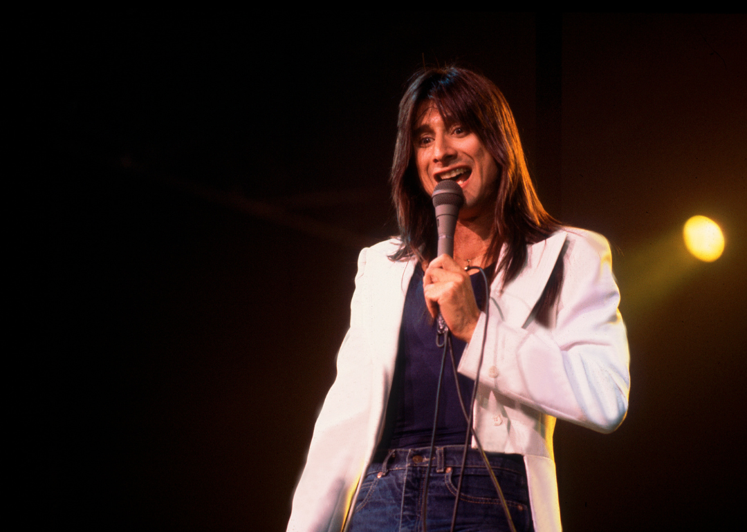 Steve Perry performing on stage in 1980.