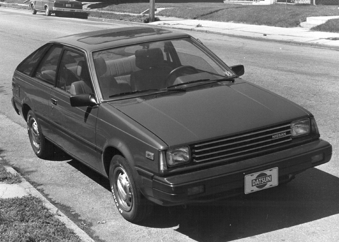 A black-and-white photo of a five-speed Nissan Sentra.