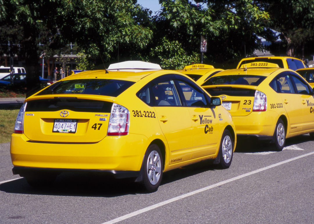 Toyota Prius yellow cars used by a taxi company in Victoria, British Columbia.