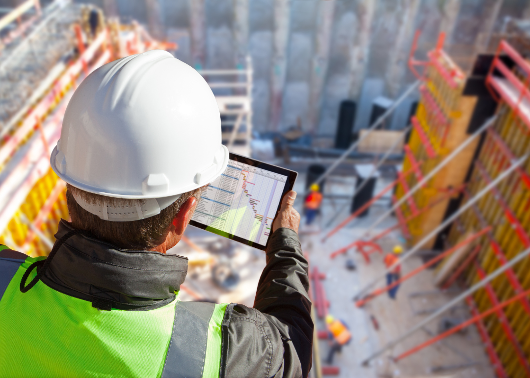 A civil engineer checking mobile construction software