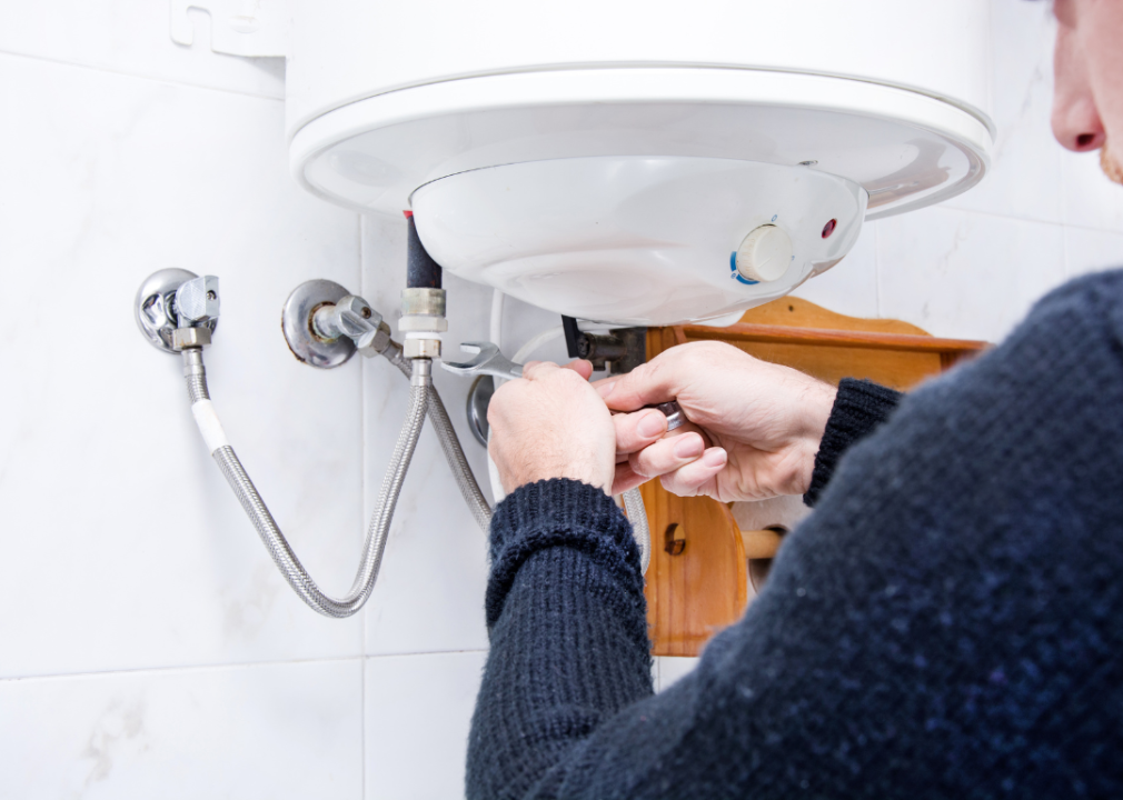 A man working on his plumbing