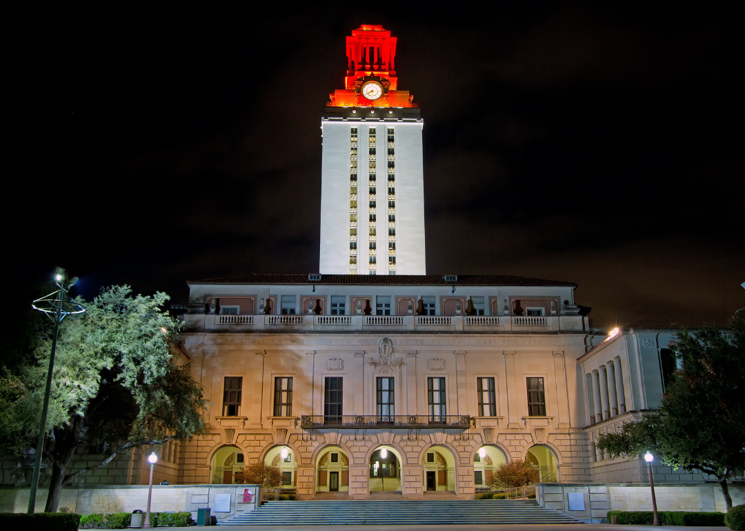 The University of Texas - Austin's tower glowing at night in white/orange to celebrate an athletic victory.