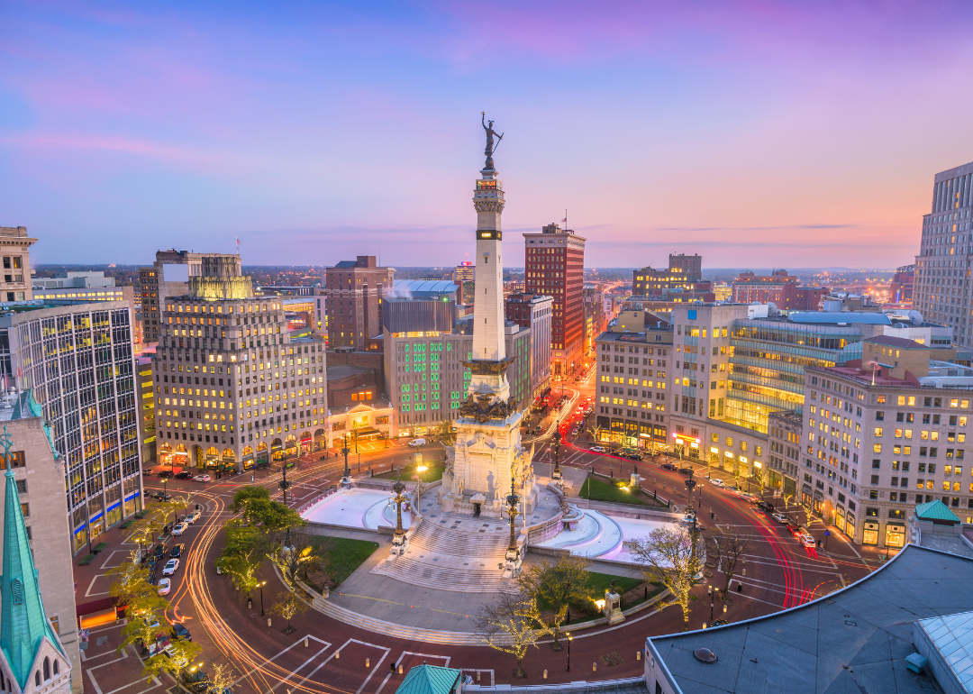 The Indianapolis skyline with a large monument in the foreground.