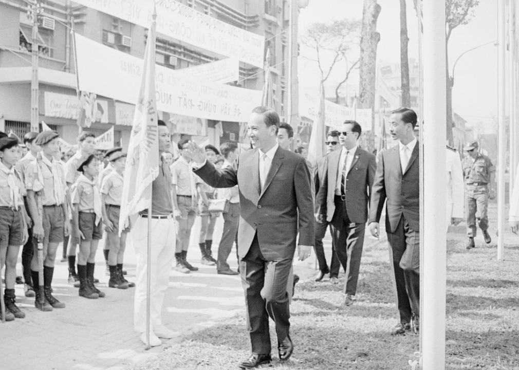President Nguyen Van Thieu waving to Guard of Honour of Vietnamese Boy Scouts after his inauguration at the National Assembly.