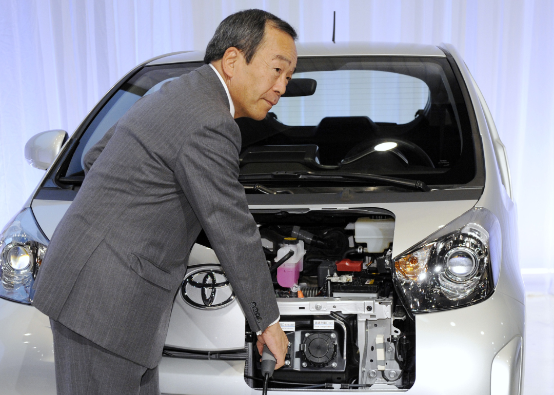 Takeshi Uchiyamada introducing the Toyota iQ EV.