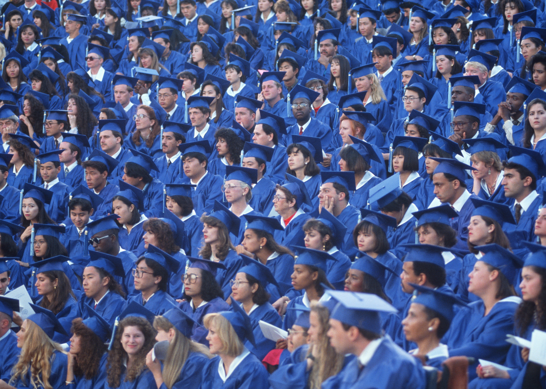 Students dressed in caps and gowns at a graduation ceremony at Santa Monica College.