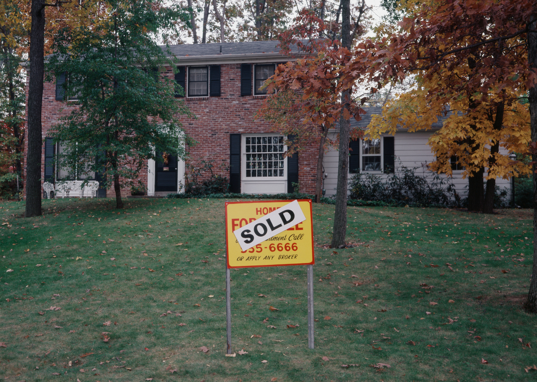 A home with a sold sign outside it in 1978.