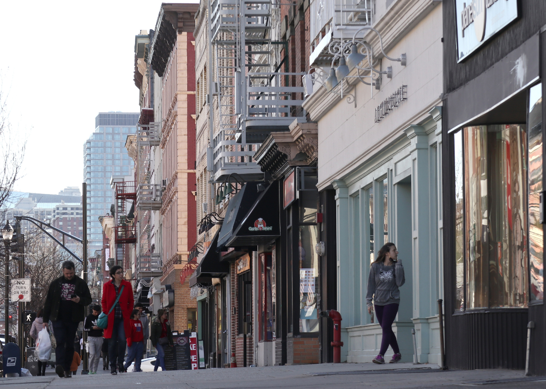 People walking along Washington Street, the main retail street in Hoboken, New Jersey. 