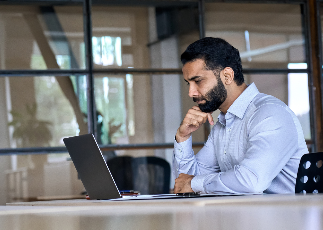 An office worker focusing on their laptop screen.